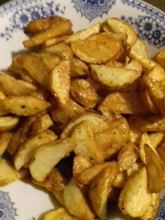 Una foto de Gajos de papas con especies