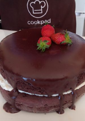 A picture of Semi-naked chocolate gateau cake.