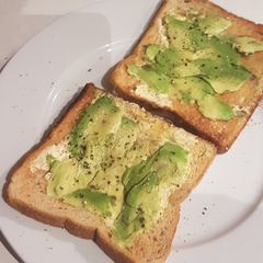 A picture of Super basic and unflattering but delicious Avocado Toast.