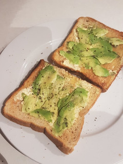 A picture of Super basic and unflattering but delicious Avocado Toast.