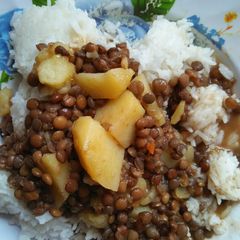 A picture of Lentiles stew with rice.