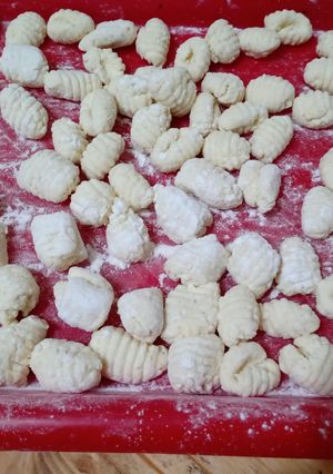 Una foto de Ñoquis de ricota y queso rallado