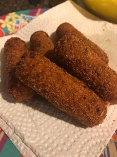 A picture of Kid friendly fried mozzarella sticks.