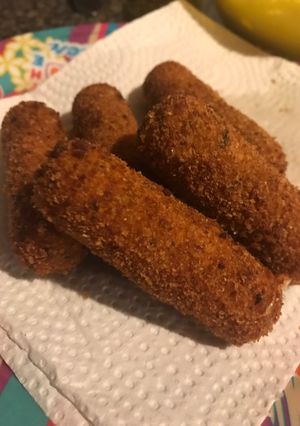 A picture of Kid friendly fried mozzarella sticks.