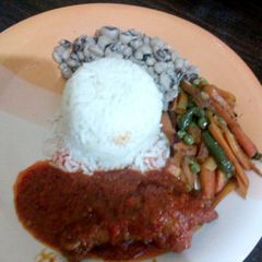 A picture of White Rice and beans with vegetables.