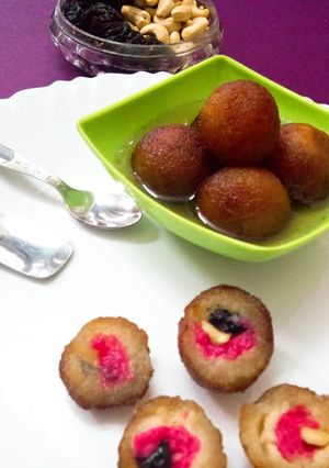 A picture of Strawberry jam nuts stuffed gulab jamun.