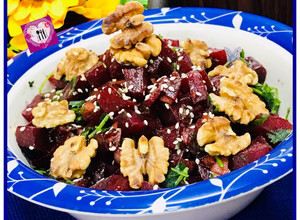 A picture of Mediterranean beet salad with dash of roasted walnuts.
