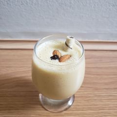 A picture of Tasty fruits and nuts milkshake.