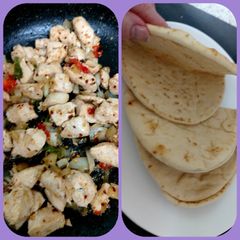 A picture of My Salt n Chilli Peppered Chicken on a folded flatbread. 😋.