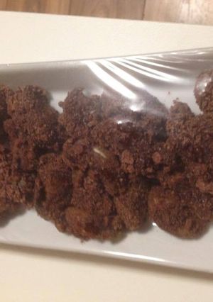 Una foto de Mandarinas crujientes bañadas de chocolate y cereales
