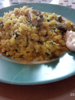 Una foto de Arroz con bacalao y espinacas
