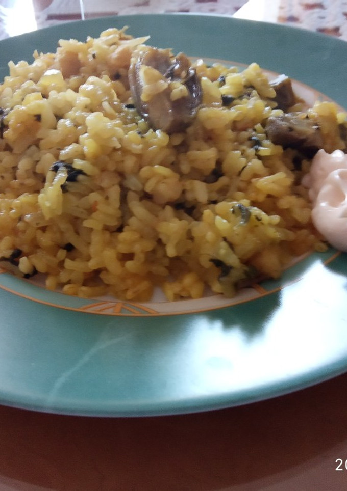 Una foto de Arroz con bacalao y espinacas