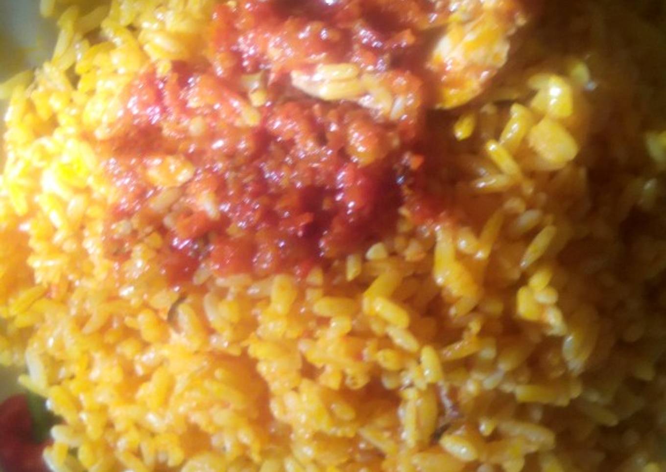 Palm oil rice and sauced fish