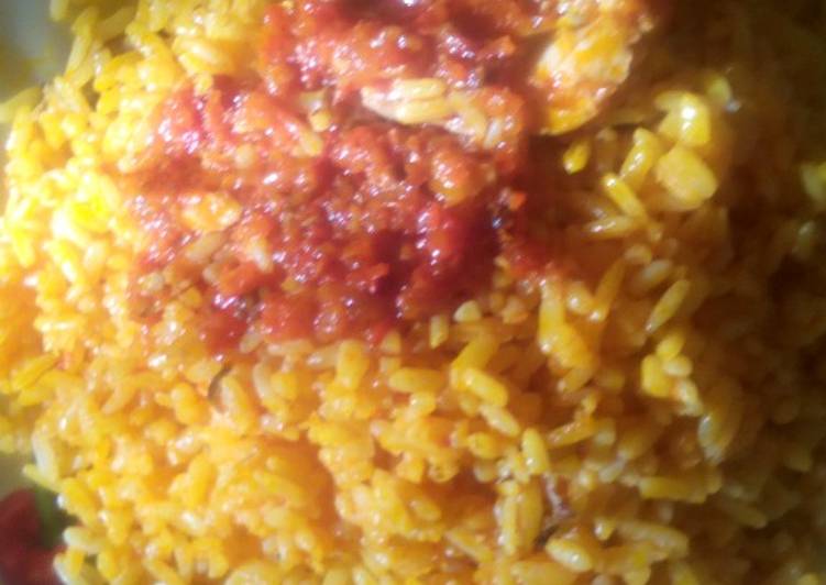 Palm oil rice and sauced fish