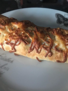 Una foto de Napolitana de bacon y queso