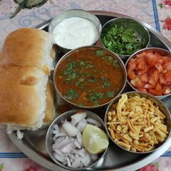 A picture of Sprouted spicy kolhapuri misal pav.
