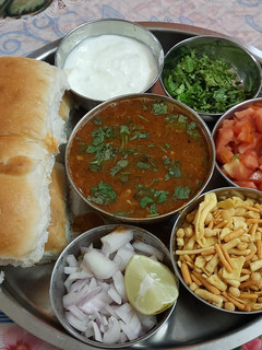 A picture of Sprouted spicy kolhapuri misal pav.
