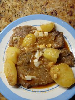 Una foto de Chuletas de cabeza con salsa