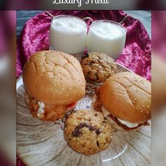 A picture of Zinger Burgers with Pineapple Smoothie and Chocolate Chip Cupcak.