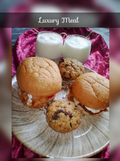 A picture of Zinger Burgers with Pineapple Smoothie and Chocolate Chip Cupcak.