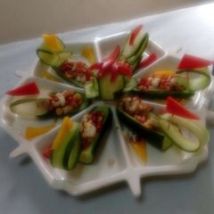 A picture of Cucumber, chickpea, pomegranate boat.