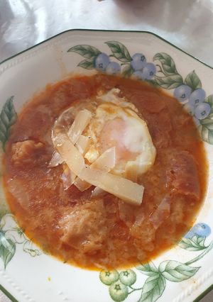 A picture of Garlic Soup with Egg and Sheep Cheese.