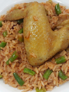 A picture of Garnished jollof rice.
