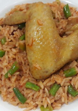 A picture of Garnished jollof rice.