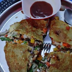 A picture of Veggies Moog,urad dal omelette dosa.