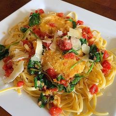 A picture of Fettuccine with Polenta, Sautéed Tomatoes, Basil & Spinach.