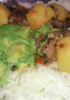 A picture of Mbuzi wet fry with rice.