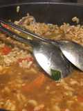 Arroz caldoso de ortigas y almejas