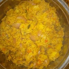 A picture of Fried couscous with potatoes and vegetables.