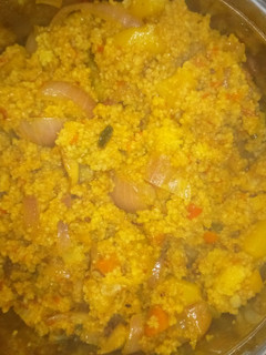 A picture of Fried couscous with potatoes and vegetables.