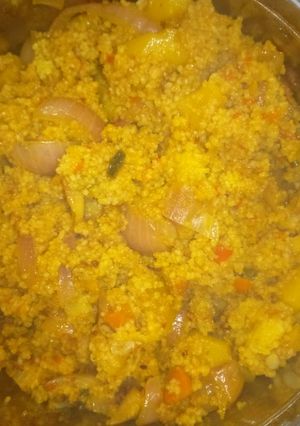 A picture of Fried couscous with potatoes and vegetables.