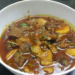 A picture of Masala mutton with potatoes.