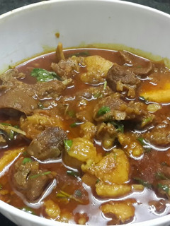 A picture of Masala mutton with potatoes.