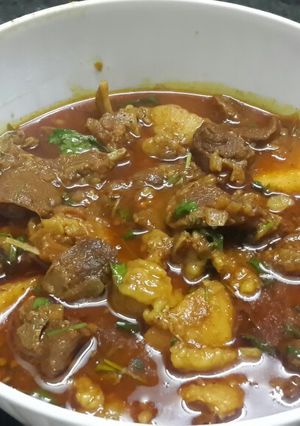 A picture of Masala mutton with potatoes.