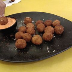 A picture of Cheesy bolls with tomato sauce.