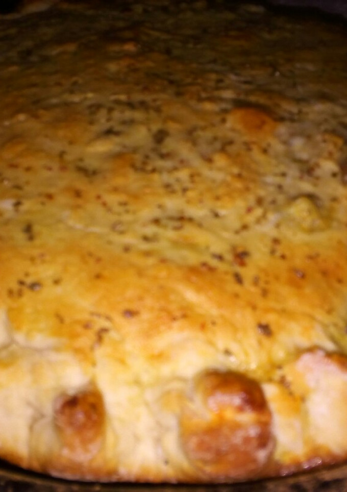 Una foto de Tarta de jamón, queso y tomate con masa de pizza