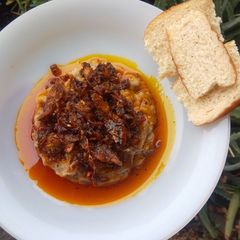 Ewa-Agonyin and its sauce/stew ("mashed bean") A picture of Ewa-Agonyin and its sauce/stew ("mashed bean").