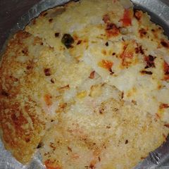 A picture of Suji onion and tomato Uttapam.
