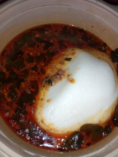 A picture of Tuwon masara with moringa soup.
