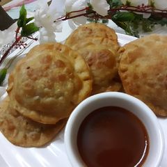A picture of Sweet potato ravioli samosa.
