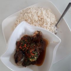 A picture of White rice and vegetable stew.
