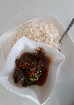 A picture of White rice and vegetable stew.