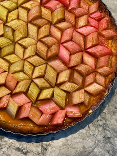 A picture of Geometric rhubarb tart with vanilla custard and shortbread crust.