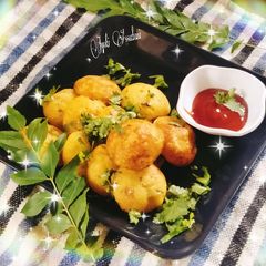 A picture of Masala paniyaRam/ masala appe.