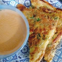 A picture of Chicken Omlate covered sandwiches.