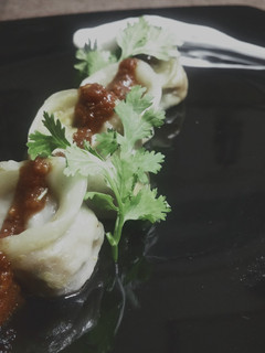 A picture of Soya Bean Ke Momos with Hot Garlic Sauce.